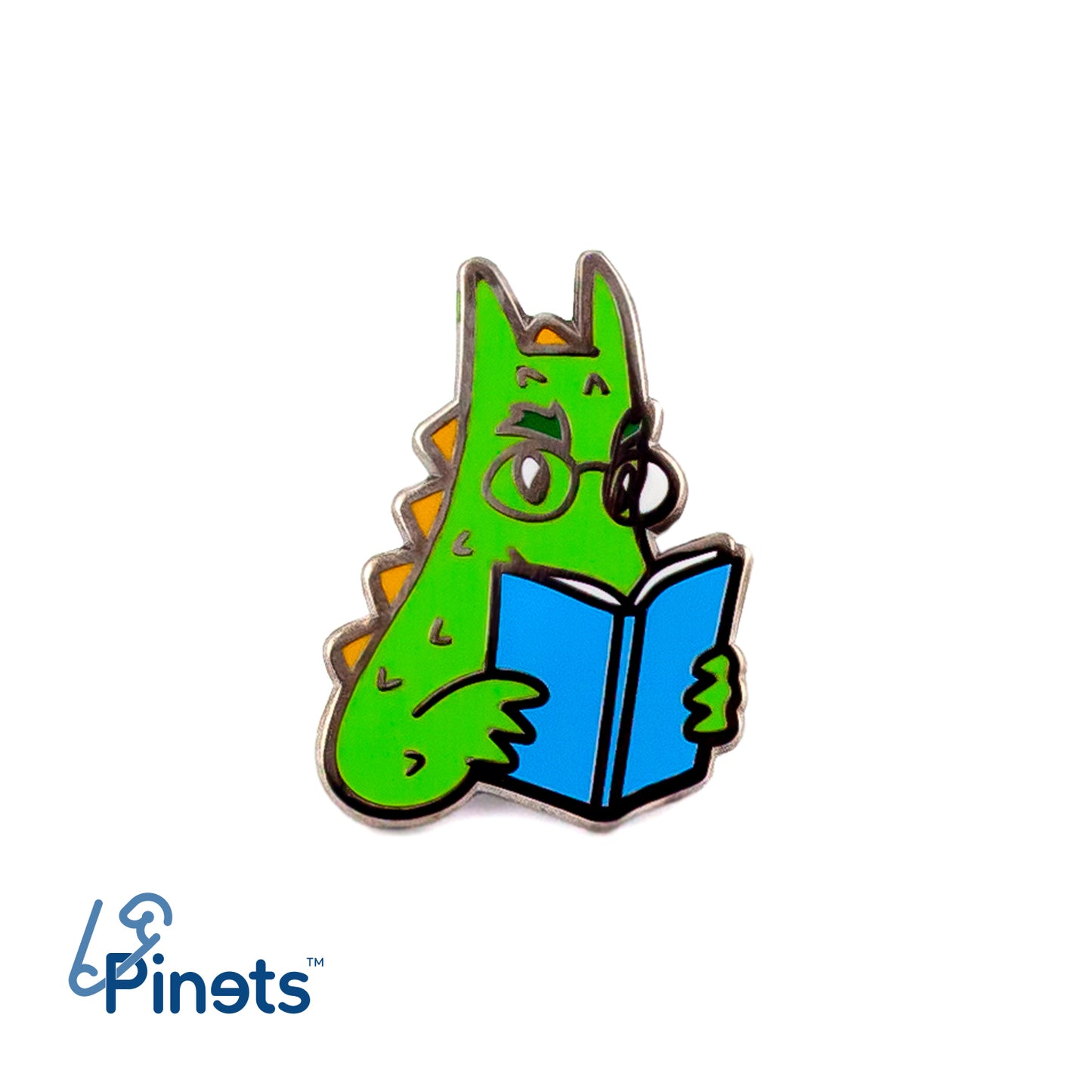 Der Wawel-Drache liest ein Buch - ein Anstecker für einen Buchliebhaber