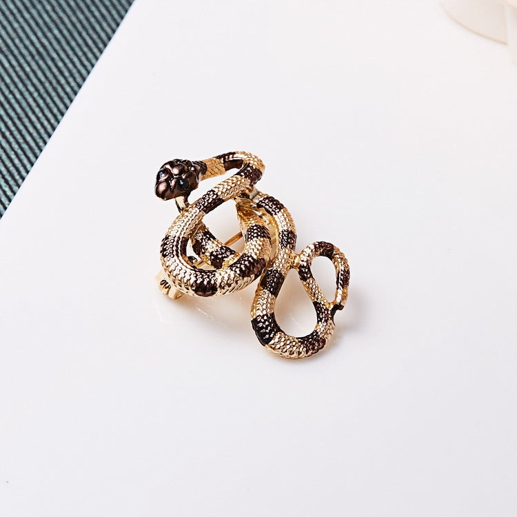 Goldene Schlangenbrosche mit Zirkonia
