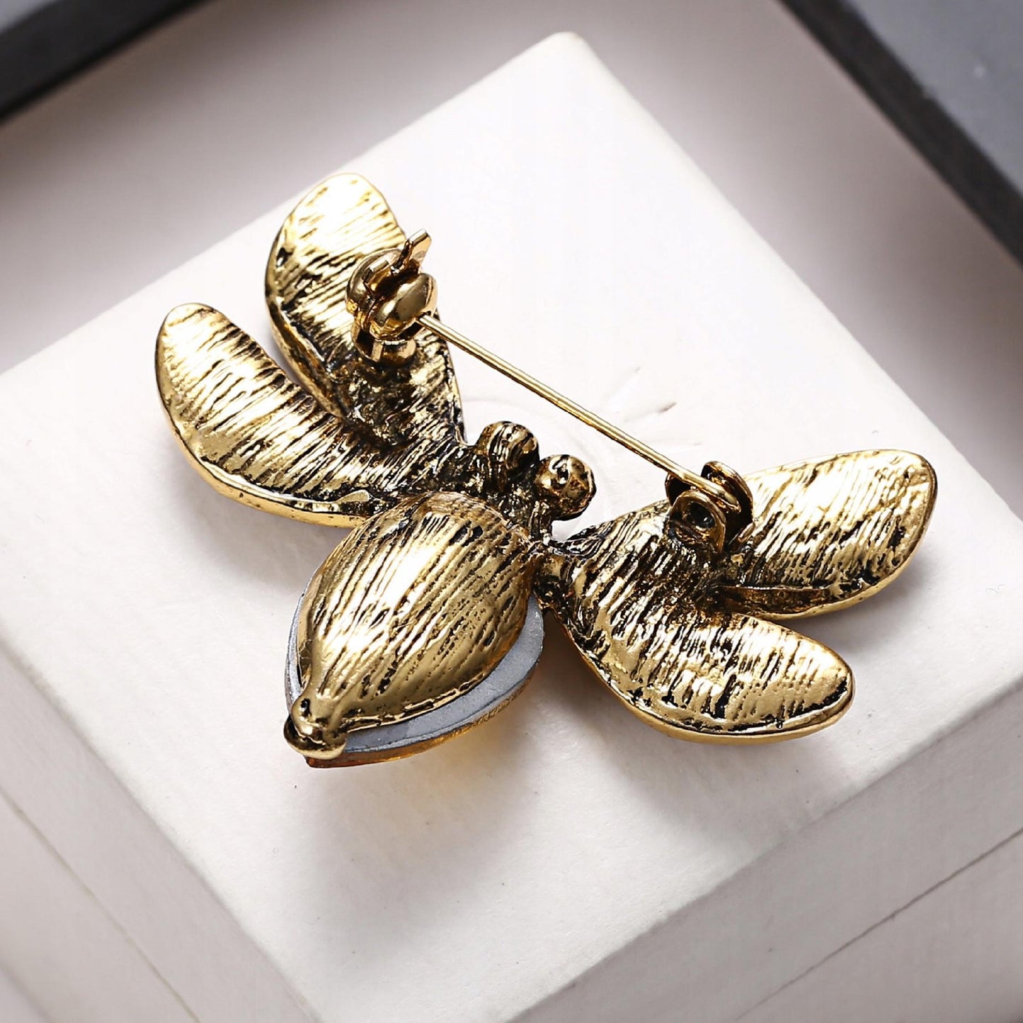Gelbe Insektenbrosche mit Zirkonia