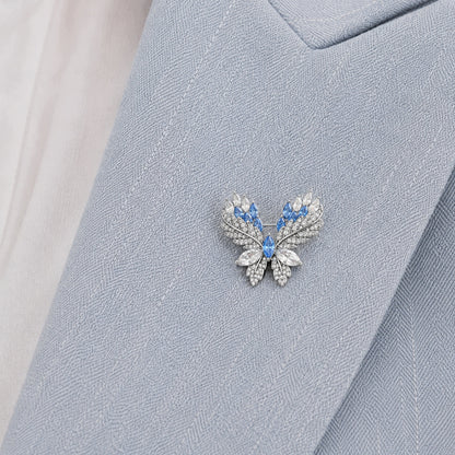 Broszka motyl srebrna z niebieskimi kryształkami elegancka damska