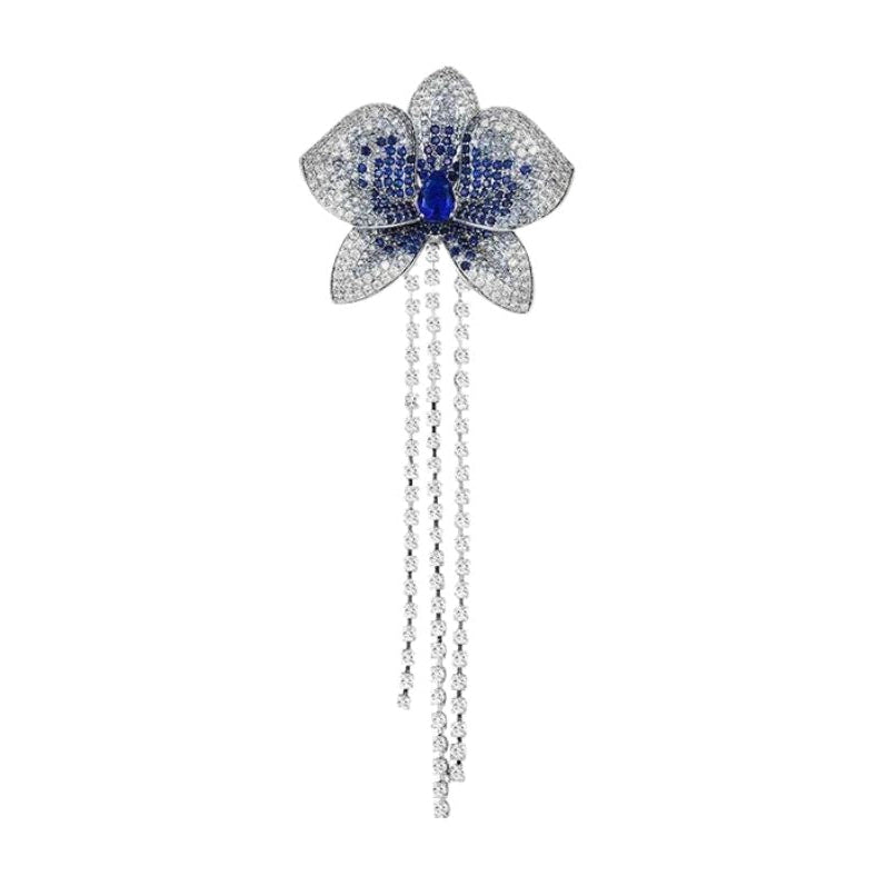 Blumenbrosche mit blauen Zirkonen und Ketten