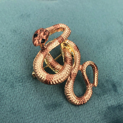 Goldene Schlangenbrosche mit Zirkonia