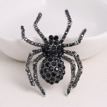 Schwarze Spinnenbrosche mit Zirkonia