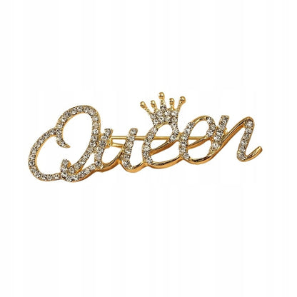 Goldinschrift „Queen“ mit einer Krone – Brosche mit Zirkonia