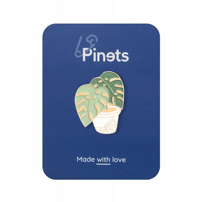Goldene Monstera-Pflanze in einem Topf Button